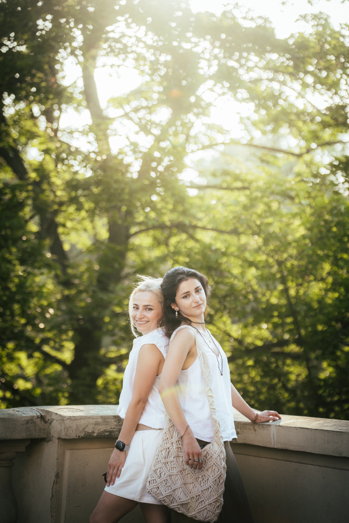 Mother and daughter in white in soft afternoon light