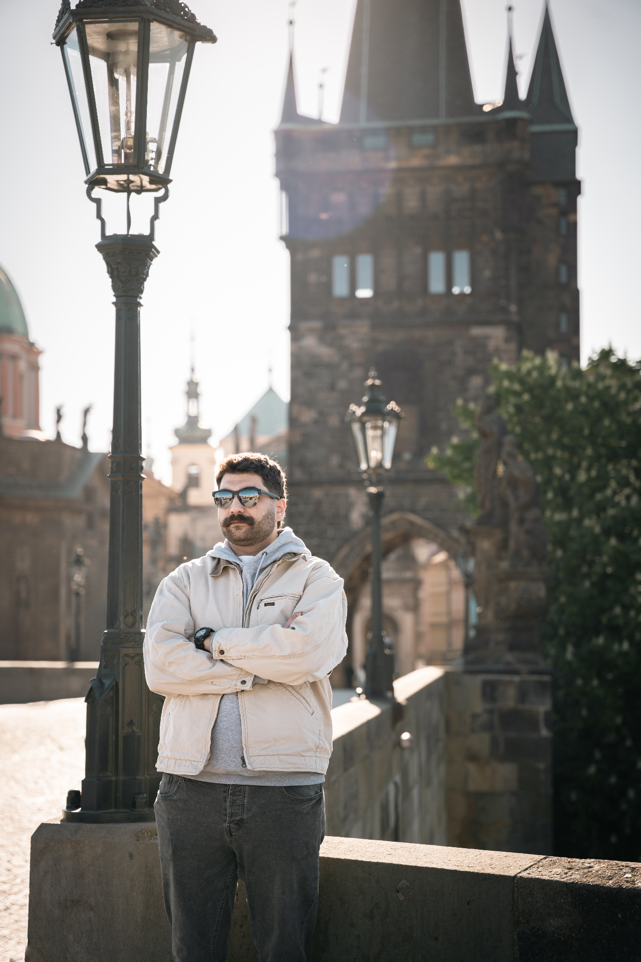 Man on Charles Bridge in morning sun